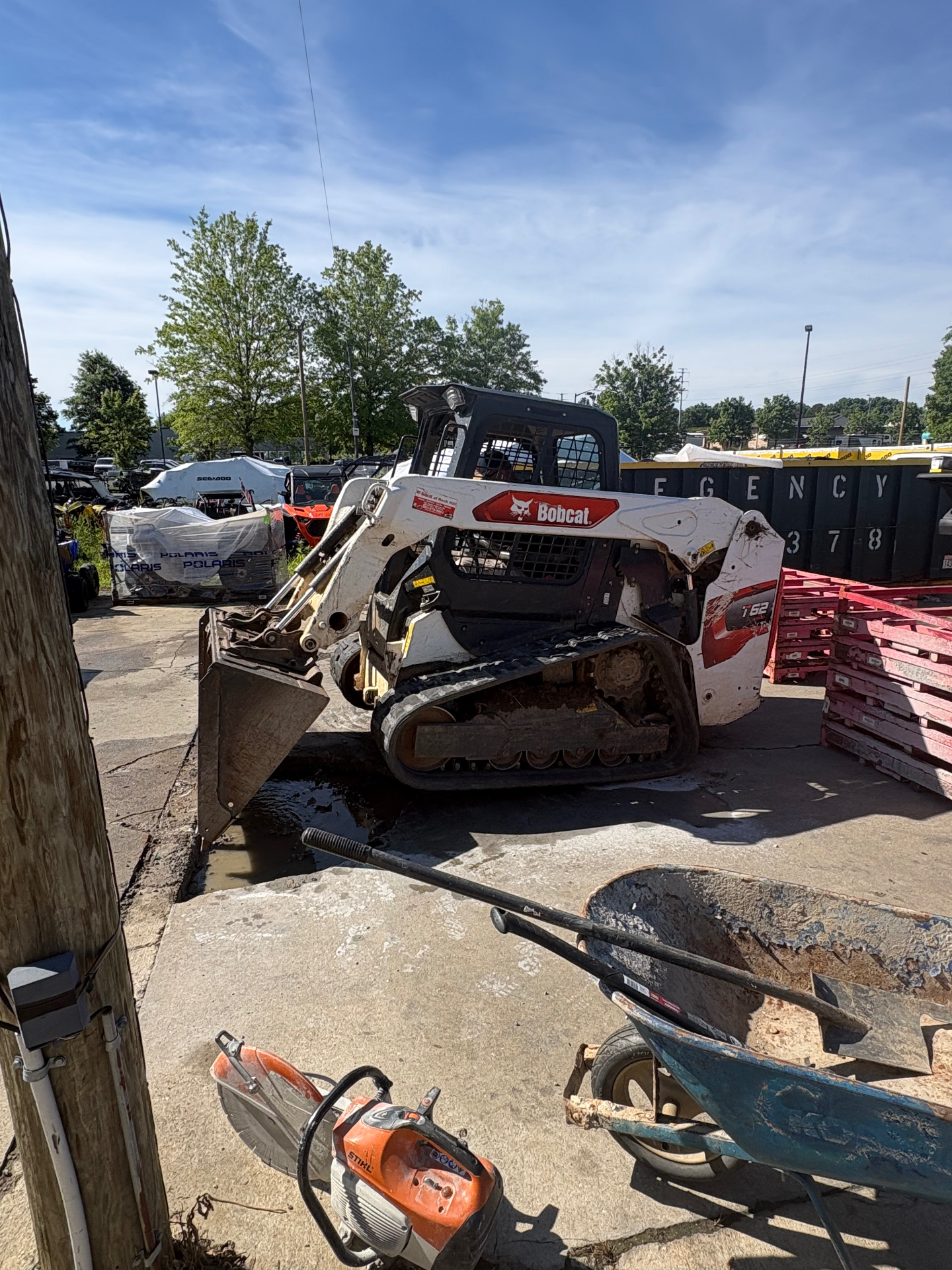 Bobcat equipment clearing land and brush